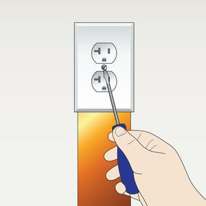 Illustration of a hand screwing a screw into an electrical outlet which has a copper grounding strap running down from it.