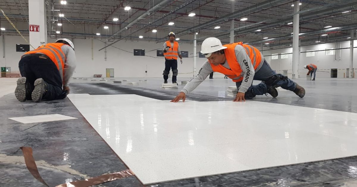 Should the adhesive be more conductive than the ESD flooring?