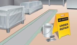 Illustration shows a manufacturing area with equipment covered by plastic sheeting and flooring taken up. A bucket and a trowel sit next to a yellow sign which reads "No entry under repair"