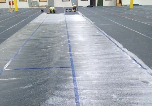 A vapor barrier being installed prior to installation of ESD flooring