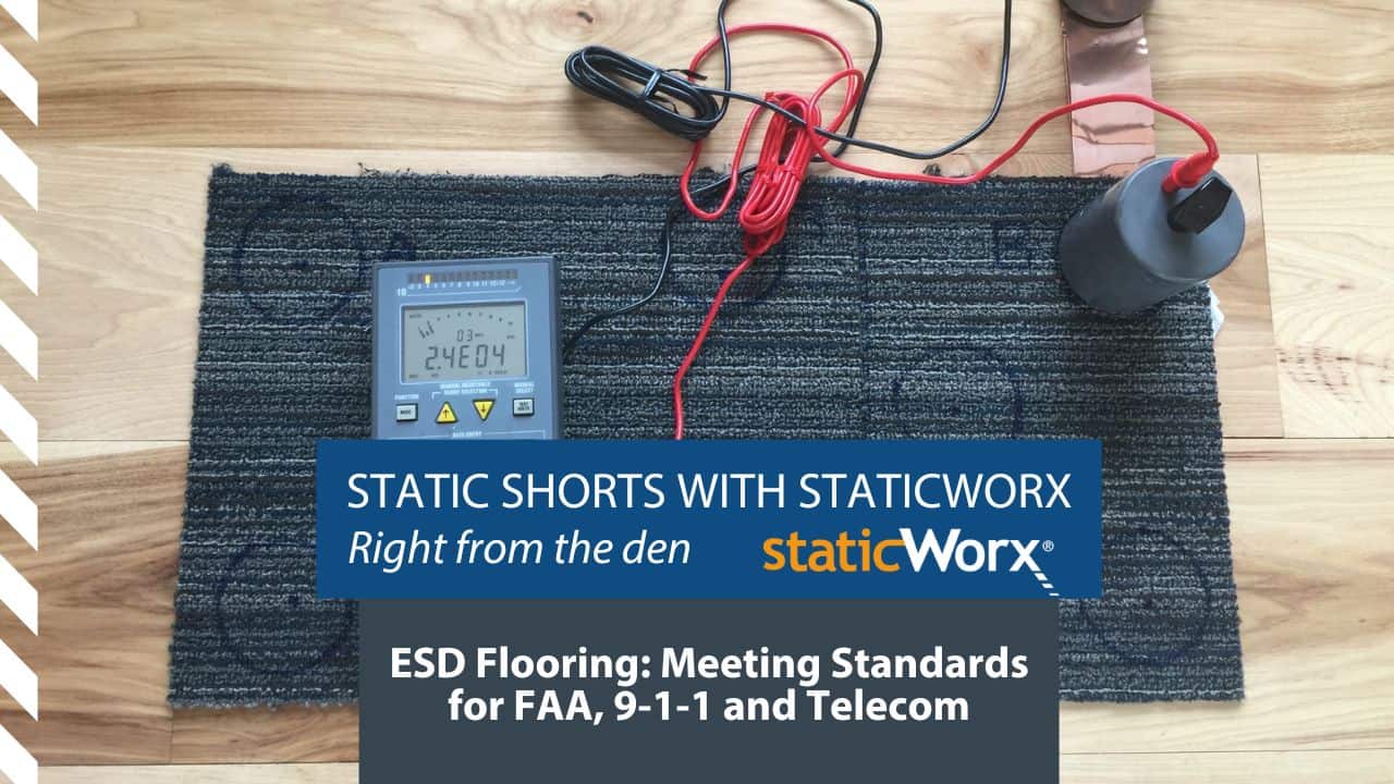 Background image is an ohm meter on a carpet tile. The title ESD Flooring: Meeting Government Standards for FAA, 9-1-1 and Telecom is displayed in bold white text against a rectangle of dark blue grey at the bottom of the image and just above is the text "Static Shorts with StaticWorx - Right from the Den" and the StaticWorx logo