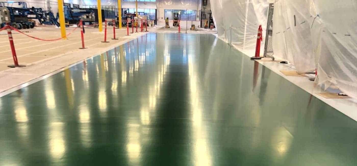 An in progress installation of GroundWorx Ultra generation 3 ESD epoxy flooring in an electronics manufacturing and assembly facility.