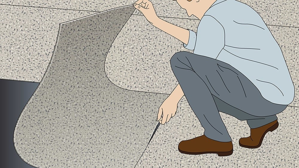 Illustration of a contractor crouching down to lay a rubber flooring title over DryFix Dry Adhesive tape.