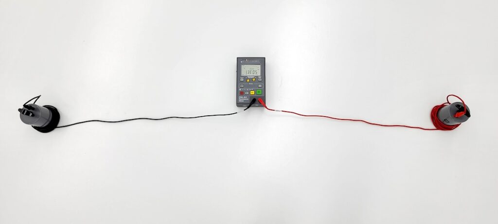 Photo of an ohmmeter being used to test resistance on an ESD epoxy floor