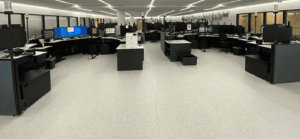 Completed installation of GroundLock Extreme ESD interlocking tile at Peel Regional Police Department. The space is filled with desks and equipment.