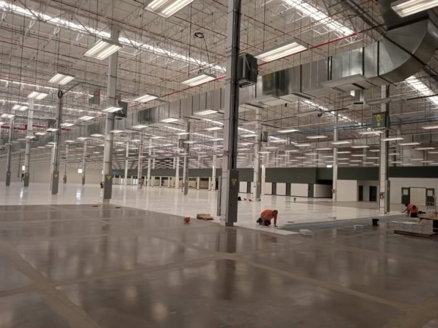 An in progress installation of AmeriWorx ESD vinyl tile after around 60,000 feat had been installed.