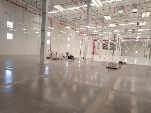 An in progress installation of AmeriWorx ESD vinyl tile after around 60,000 feat had been installed.